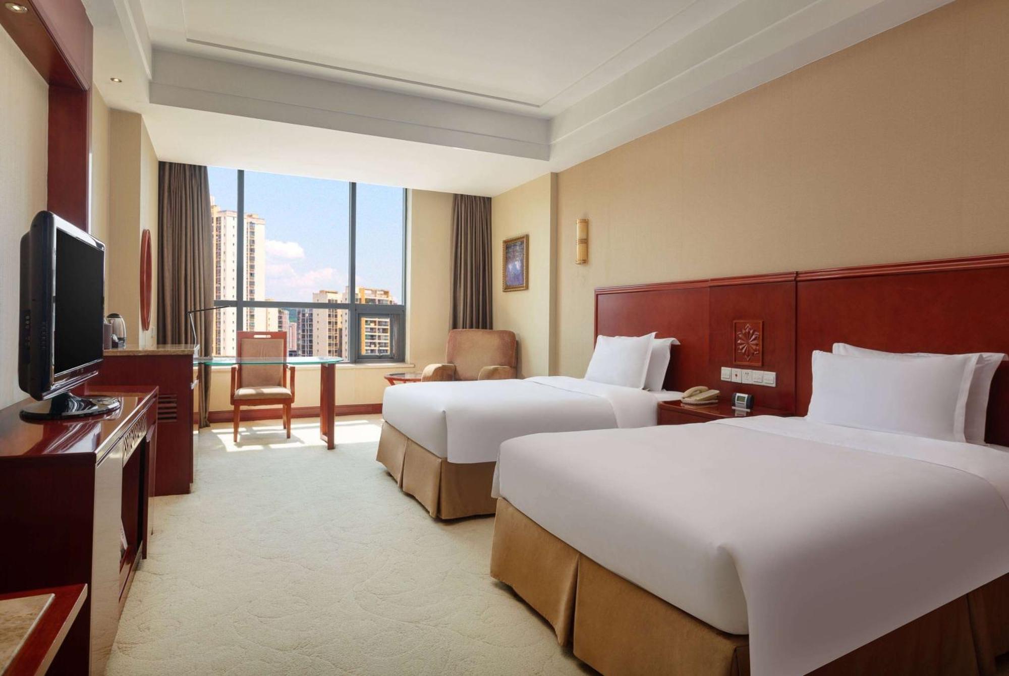 Отель Ramada Plaza By Wyndham Chongqing West Экстерьер фото